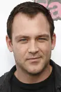 Porträtt av Ty Olsson