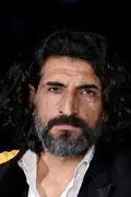 Porträtt av Numan Acar