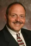 Porträtt av John Moschitta Jr.